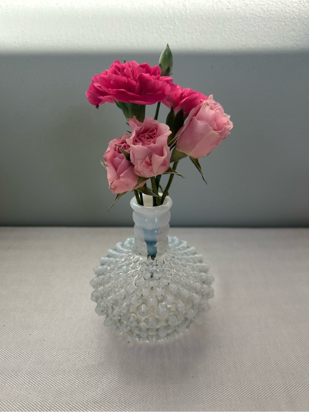 Fenton Clear Hobnail Bud Vase with Pink Blooms